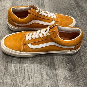 Vans “Off The Wall” tennis shoes.